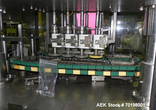 Used Resina Model NRU51 High Speed Automatic Inline Quill Capper. Machine is capable of speeds up to 300 bpm. Cap size range: 10mm to 89mm with changeparts. Equipped with dual belt gripper, H26 exten...