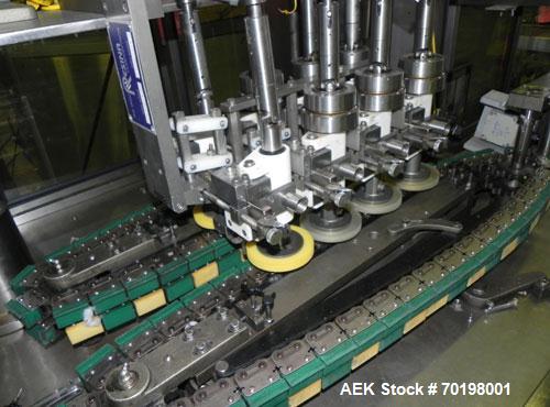 Used Resina Model NRU51 High Speed Automatic Inline Quill Capper. Machine is capable of speeds up to 300 bpm. Cap size range: 10mm to 89mm with changeparts. Equipped with dual belt gripper, H26 exten...