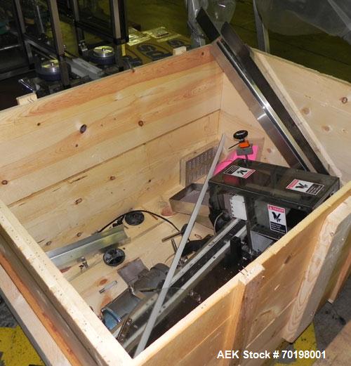 Used Resina Model NRU51 High Speed Automatic Inline Quill Capper. Machine is capable of speeds up to 300 bpm. Cap size range: 10mm to 89mm with changeparts. Equipped with dual belt gripper, H26 exten...