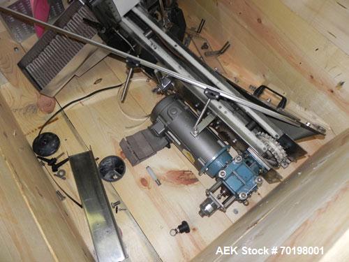 Used Resina Model NRU51 High Speed Automatic Inline Quill Capper. Machine is capable of speeds up to 300 bpm. Cap size range: 10mm to 89mm with changeparts. Equipped with dual belt gripper, H26 exten...