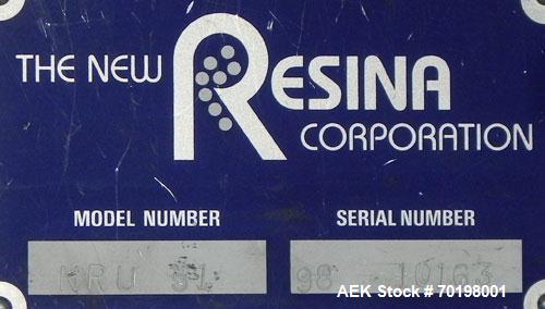 Used Resina Model NRU51 High Speed Automatic Inline Quill Capper. Machine is capable of speeds up to 300 bpm. Cap size range: 10mm to 89mm with changeparts. Equipped with dual belt gripper, H26 exten...