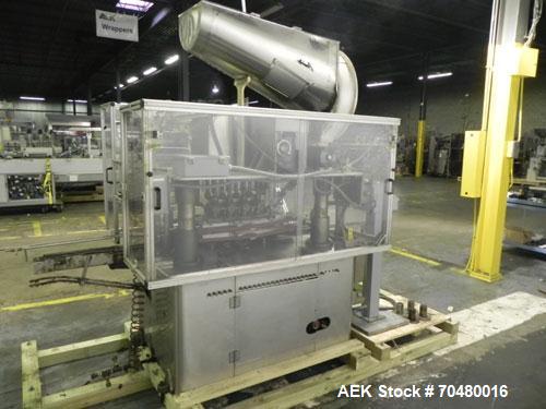 Used Resina Model U40-663 Automatic Inline Capper. Machine is capable of speeds up to 300 caps per minute. Adjustable from 10mm-70mm caps. Has top mounted cap sorter with hopper. Machine has 2HR pin ...