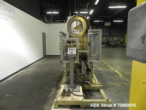 Used Resina Model U40-663 Automatic Inline Capper. Machine is capable of speeds up to 300 caps per minute. Adjustable from 10mm-70mm caps. Has top mounted cap sorter with hopper. Machine has 2HR pin ...