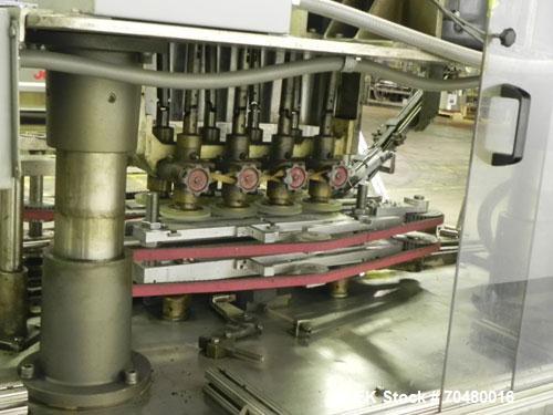 Used Resina Model U40-663 Automatic Inline Capper. Machine is capable of speeds up to 300 caps per minute. Adjustable from 10mm-70mm caps. Has top mounted cap sorter with hopper. Machine has 2HR pin ...