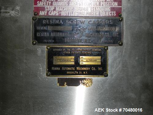 Used Resina Model U40-663 Automatic Inline Capper. Machine is capable of speeds up to 300 caps per minute. Adjustable from 10mm-70mm caps. Has top mounted cap sorter with hopper. Machine has 2HR pin ...
