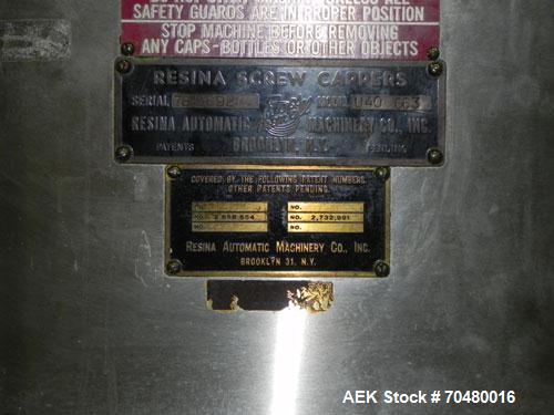 Used Resina Model U40-663 Automatic Inline Capper. Machine is capable of speeds up to 300 caps per minute. Adjustable from 10mm-70mm caps. Has top mounted cap sorter with hopper. Machine has 2HR pin ...