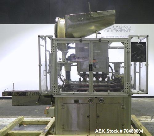 Used Resina Model U40 Automatic Inline Quill Capper. Capable of speeds up to 250 containers per minute. Cap size range 13mm to 70mm (with changeparts). Has 2HR pin style cap sorter, cap chute with no...