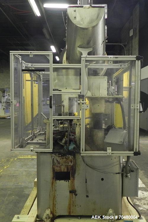 Used Resina Model U40 Automatic Inline Quill Capper. Capable of speeds up to 250 containers per minute. Cap size range 13mm to 70mm (with changeparts). Has 2HR pin style cap sorter, cap chute with no...