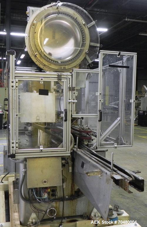 Used Resina Model U40 Automatic Inline Quill Capper. Capable of speeds up to 250 containers per minute. Cap size range 13mm to 70mm (with changeparts). Has 2HR pin style cap sorter, cap chute with no...