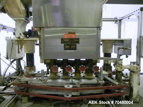 Used Resina Model U40 Automatic Inline Quill Capper. Capable of speeds up to 250 containers per minute. Cap size range 13mm to 70mm (with changeparts). Has 2HR pin style cap sorter, cap chute with no...