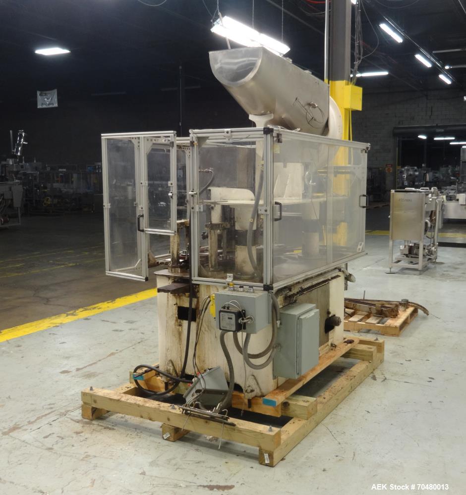 Used Resina Model U40-206 Automatic Inline Capper