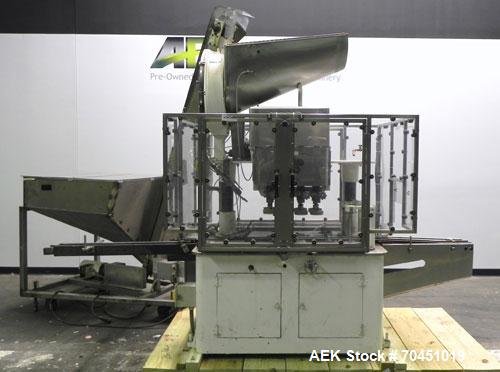 Used Resina Model U40 Automatic Inline Quill Capper. Capable of speeds up to 250 containers per minute. Cap size range: 13mm to 70mm (with changeparts). Currently set up on mm caps. Has 2HR pin style...