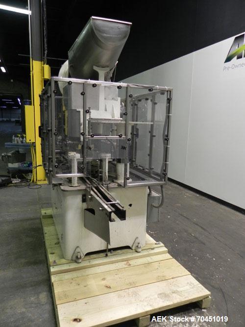 Used Resina Model U40 Automatic Inline Quill Capper. Capable of speeds up to 250 containers per minute. Cap size range: 13mm to 70mm (with changeparts). Currently set up on mm caps. Has 2HR pin style...