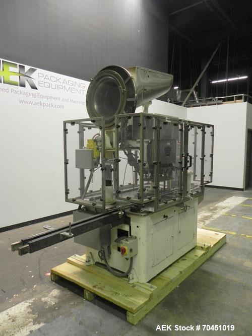 Used Resina Model U40 Automatic Inline Quill Capper. Capable of speeds up to 250 containers per minute. Cap size range: 13mm to 70mm (with changeparts). Currently set up on mm caps. Has 2HR pin style...