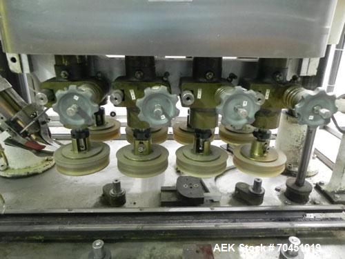 Used Resina Model U40 Automatic Inline Quill Capper. Capable of speeds up to 250 containers per minute. Cap size range: 13mm to 70mm (with changeparts). Currently set up on mm caps. Has 2HR pin style...