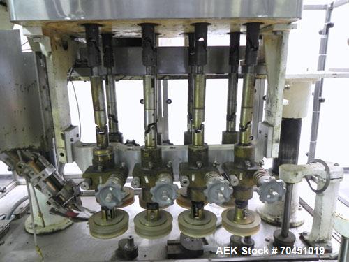 Used Resina Model U40 Automatic Inline Quill Capper. Capable of speeds up to 250 containers per minute. Cap size range: 13mm to 70mm (with changeparts). Currently set up on mm caps. Has 2HR pin style...
