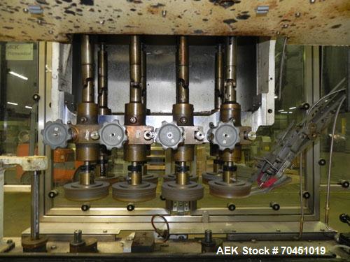 Used Resina Model U40 Automatic Inline Quill Capper. Capable of speeds up to 250 containers per minute. Cap size range: 13mm to 70mm (with changeparts). Currently set up on mm caps. Has 2HR pin style...
