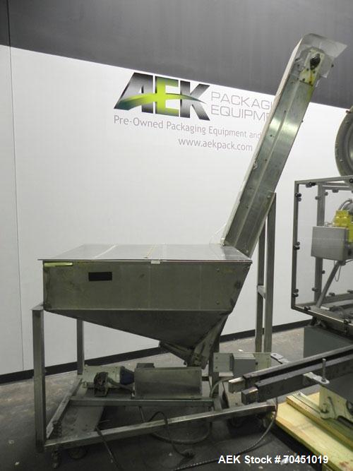 Used Resina Model U40 Automatic Inline Quill Capper. Capable of speeds up to 250 containers per minute. Cap size range: 13mm to 70mm (with changeparts). Currently set up on mm caps. Has 2HR pin style...
