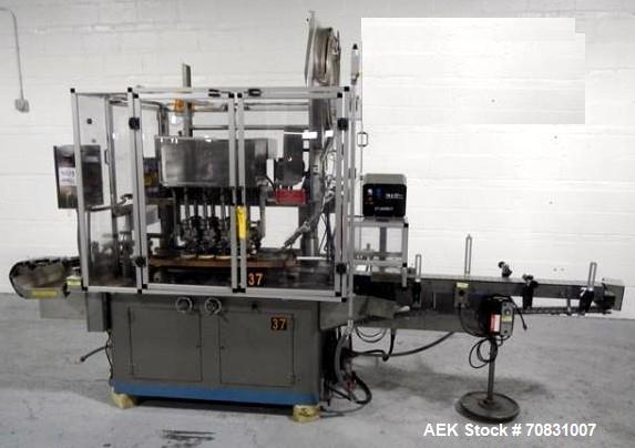 Used Resina Model U40 Automatic Inline Capper. Machine is capable of speeds up to 300 caps per minute. Is a 4 station capper with 8 spindle quills. Adjustable from 10mm-70mm caps. Has top mounted cap...