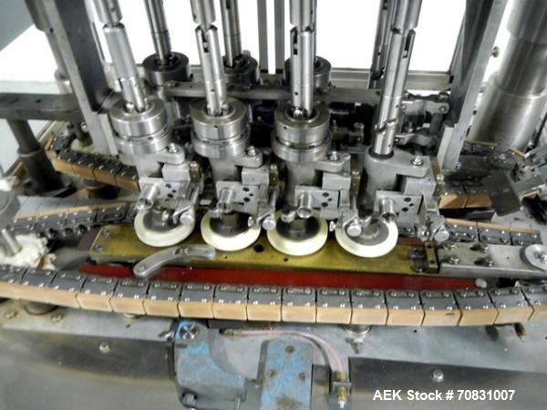 Used Resina Model U40 Automatic Inline Capper. Machine is capable of speeds up to 300 caps per minute. Is a 4 station capper with 8 spindle quills. Adjustable from 10mm-70mm caps. Has top mounted cap...