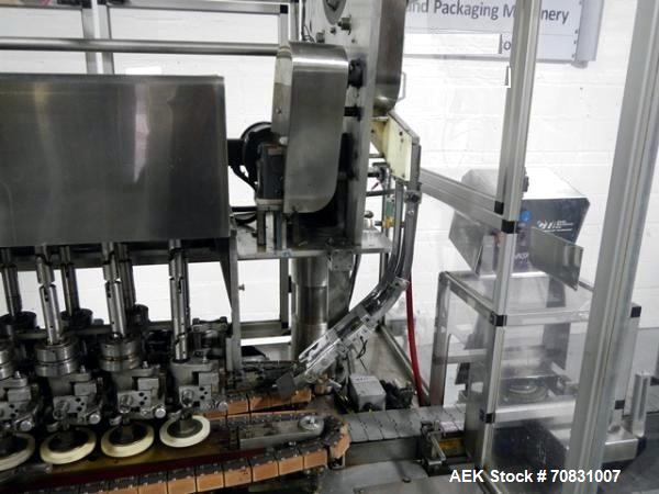 Used Resina Model U40 Automatic Inline Capper. Machine is capable of speeds up to 300 caps per minute. Is a 4 station capper with 8 spindle quills. Adjustable from 10mm-70mm caps. Has top mounted cap...