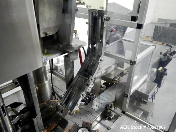 Used Resina Model U40 Automatic Inline Capper. Machine is capable of speeds up to 300 caps per minute. Is a 4 station capper with 8 spindle quills. Adjustable from 10mm-70mm caps. Has top mounted cap...