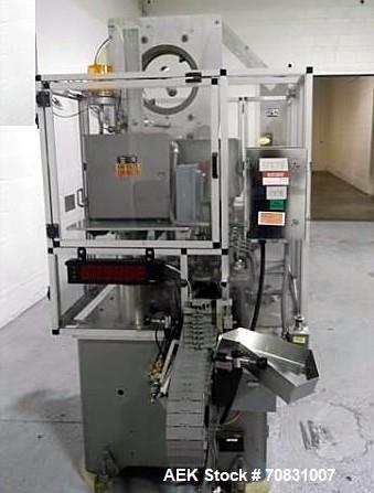 Used Resina Model U40 Automatic Inline Capper. Machine is capable of speeds up to 300 caps per minute. Is a 4 station capper with 8 spindle quills. Adjustable from 10mm-70mm caps. Has top mounted cap...