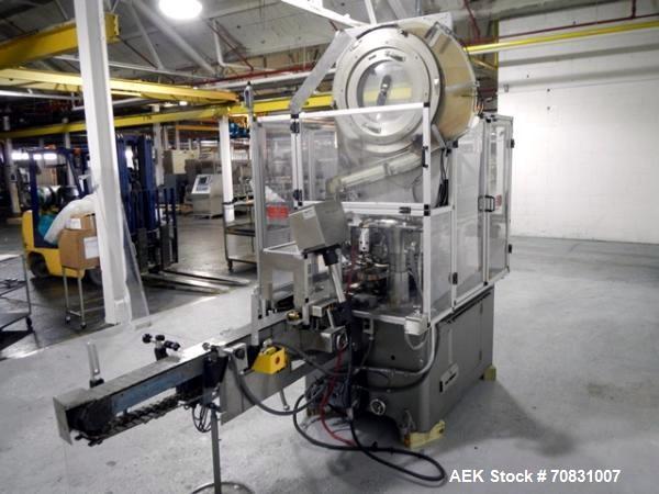 Used Resina Model U40 Automatic Inline Capper. Machine is capable of speeds up to 300 caps per minute. Is a 4 station capper with 8 spindle quills. Adjustable from 10mm-70mm caps. Has top mounted cap...