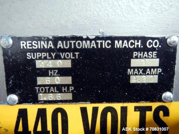 Used Resina Model U40 Automatic Inline Capper. Machine is capable of speeds up to 300 caps per minute. Is a 4 station capper with 8 spindle quills. Adjustable from 10mm-70mm caps. Has top mounted cap...