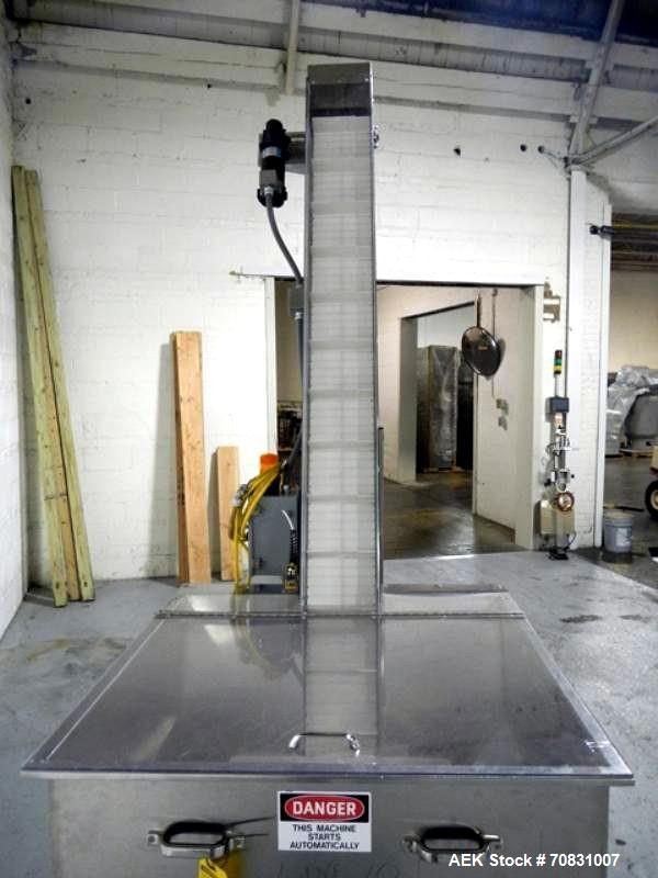 Used Resina Model U40 Automatic Inline Capper. Machine is capable of speeds up to 300 caps per minute. Is a 4 station capper with 8 spindle quills. Adjustable from 10mm-70mm caps. Has top mounted cap...