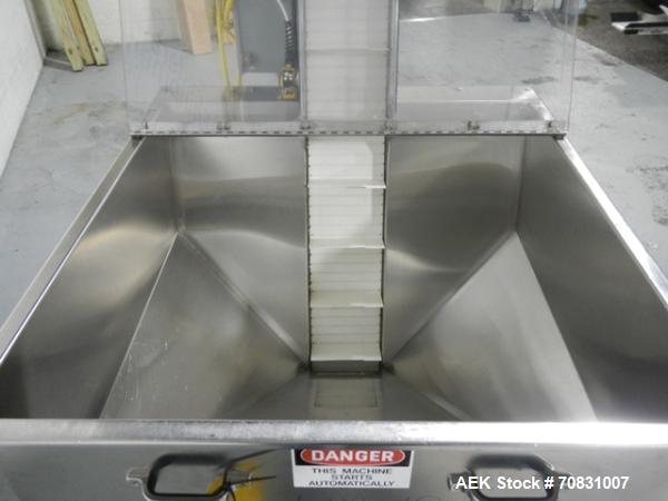 Used Resina Model U40 Automatic Inline Capper. Machine is capable of speeds up to 300 caps per minute. Is a 4 station capper with 8 spindle quills. Adjustable from 10mm-70mm caps. Has top mounted cap...