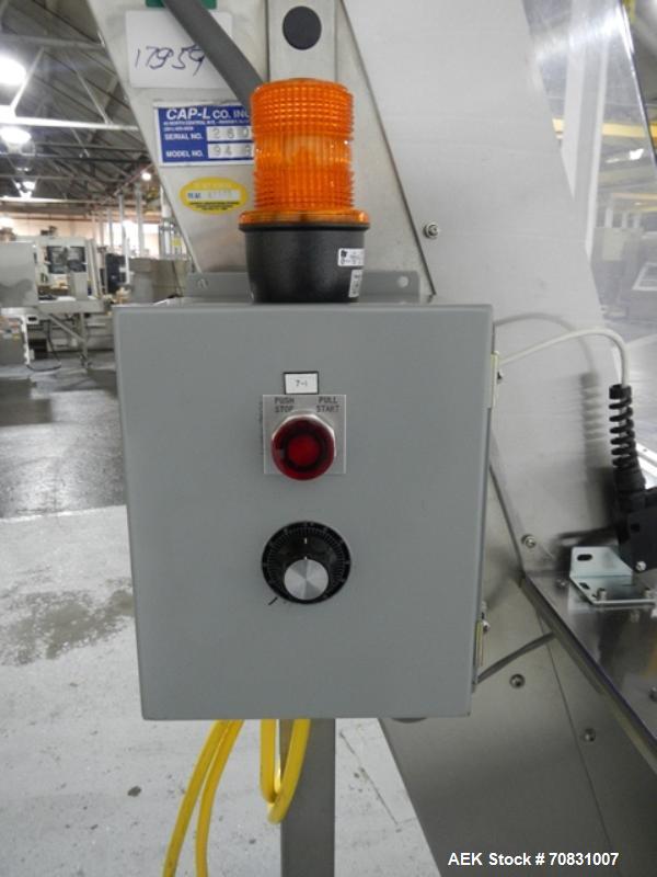 Used Resina Model U40 Automatic Inline Capper. Machine is capable of speeds up to 300 caps per minute. Is a 4 station capper with 8 spindle quills. Adjustable from 10mm-70mm caps. Has top mounted cap...
