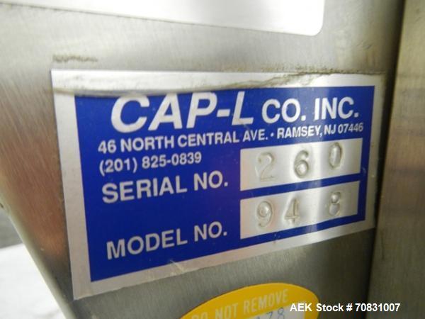 Used Resina Model U40 Automatic Inline Capper. Machine is capable of speeds up to 300 caps per minute. Is a 4 station capper with 8 spindle quills. Adjustable from 10mm-70mm caps. Has top mounted cap...