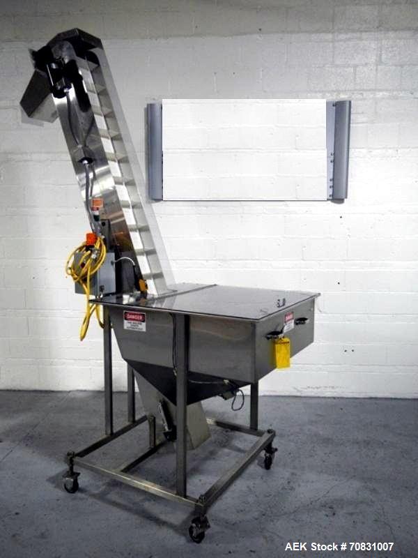 Used Resina Model U40 Automatic Inline Capper. Machine is capable of speeds up to 300 caps per minute. Is a 4 station capper with 8 spindle quills. Adjustable from 10mm-70mm caps. Has top mounted cap...