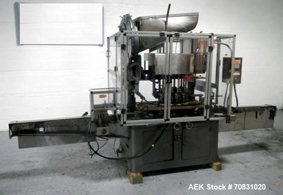 Used Resina Model U40 Automatic Inline Capper. Machine is capable of speeds up to 300 caps per minute. Is a 4 station capper with 8 spindle quills. Adjustable from 10mm-70mm caps. Has top mounted cap...