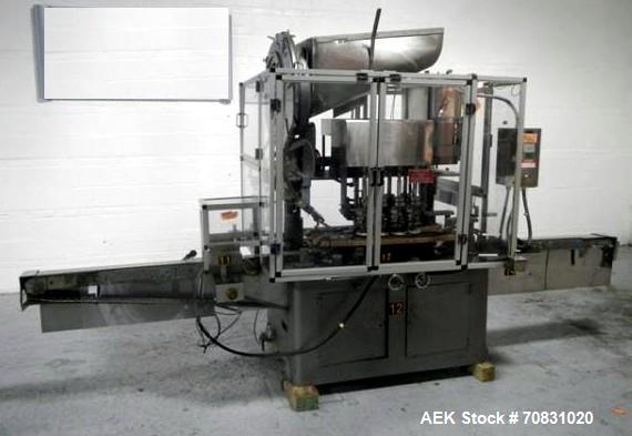 Used- Resina Model U40 Automatic Inline Capper. Machine is capable of speeds up to 300 caps per minute. Is a 4 station cappe...