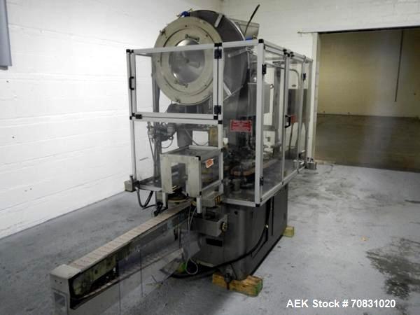 Used Resina Model U40 Automatic Inline Capper. Machine is capable of speeds up to 300 caps per minute. Is a 4 station capper with 8 spindle quills. Adjustable from 10mm-70mm caps. Has top mounted cap...