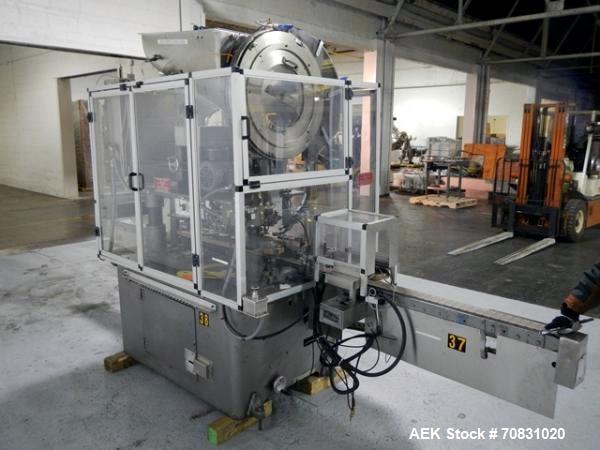 Used Resina Model U40 Automatic Inline Capper. Machine is capable of speeds up to 300 caps per minute. Is a 4 station capper with 8 spindle quills. Adjustable from 10mm-70mm caps. Has top mounted cap...