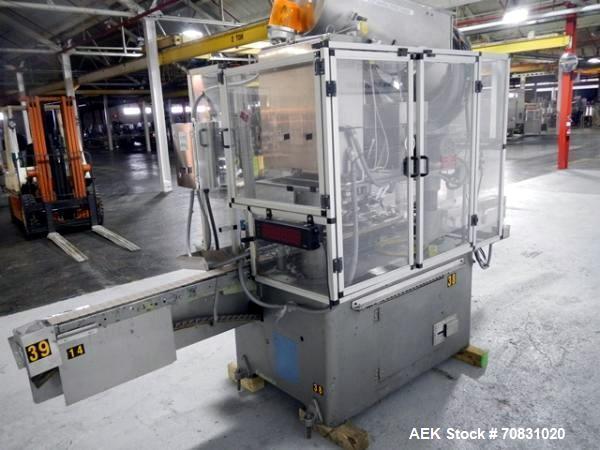 Used Resina Model U40 Automatic Inline Capper. Machine is capable of speeds up to 300 caps per minute. Is a 4 station capper with 8 spindle quills. Adjustable from 10mm-70mm caps. Has top mounted cap...