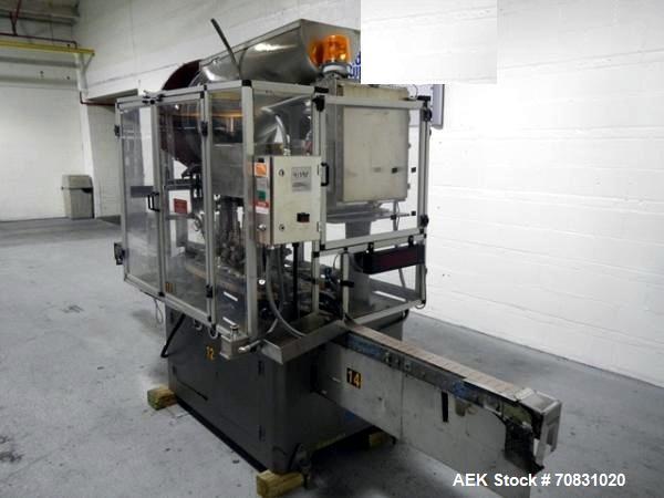 Used Resina Model U40 Automatic Inline Capper. Machine is capable of speeds up to 300 caps per minute. Is a 4 station capper with 8 spindle quills. Adjustable from 10mm-70mm caps. Has top mounted cap...