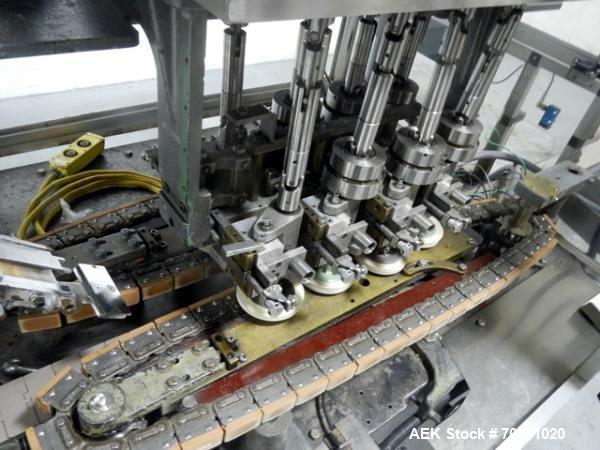 Used Resina Model U40 Automatic Inline Capper. Machine is capable of speeds up to 300 caps per minute. Is a 4 station capper with 8 spindle quills. Adjustable from 10mm-70mm caps. Has top mounted cap...