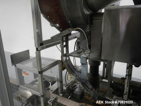 Used Resina Model U40 Automatic Inline Capper. Machine is capable of speeds up to 300 caps per minute. Is a 4 station capper with 8 spindle quills. Adjustable from 10mm-70mm caps. Has top mounted cap...