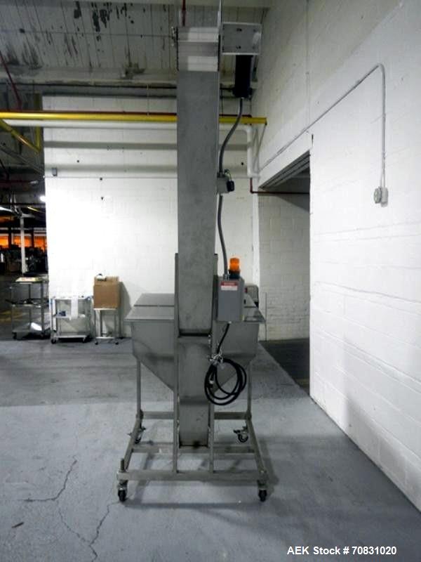 Used Resina Model U40 Automatic Inline Capper. Machine is capable of speeds up to 300 caps per minute. Is a 4 station capper with 8 spindle quills. Adjustable from 10mm-70mm caps. Has top mounted cap...