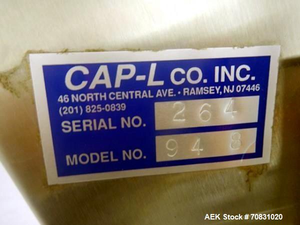 Used Resina Model U40 Automatic Inline Capper. Machine is capable of speeds up to 300 caps per minute. Is a 4 station capper with 8 spindle quills. Adjustable from 10mm-70mm caps. Has top mounted cap...