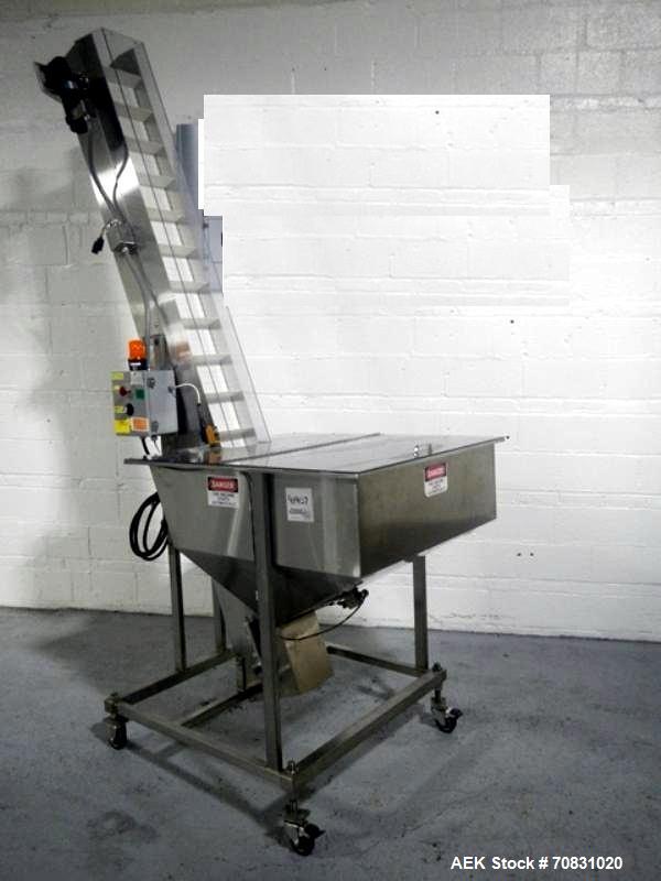 Used Resina Model U40 Automatic Inline Capper. Machine is capable of speeds up to 300 caps per minute. Is a 4 station capper with 8 spindle quills. Adjustable from 10mm-70mm caps. Has top mounted cap...