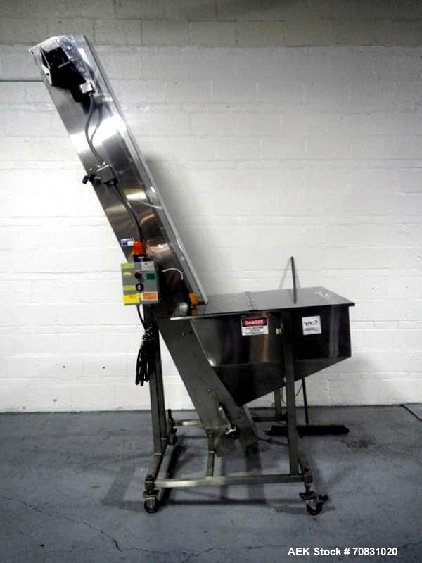Used Resina Model U40 Automatic Inline Capper. Machine is capable of speeds up to 300 caps per minute. Is a 4 station capper with 8 spindle quills. Adjustable from 10mm-70mm caps. Has top mounted cap...