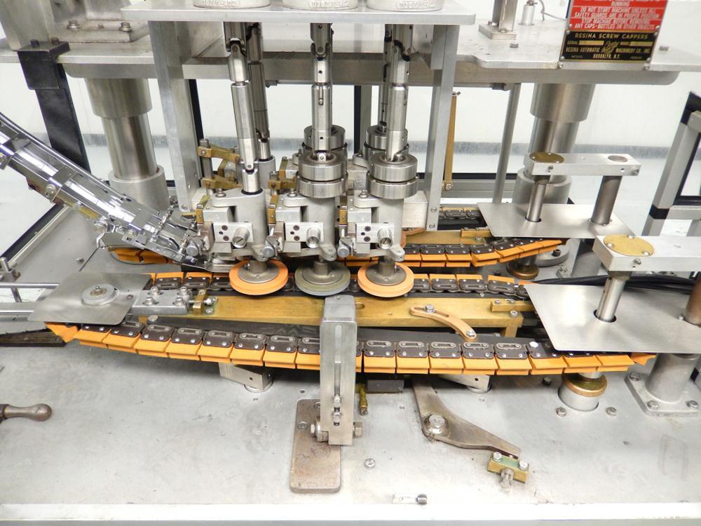 Used Resina Model UN-30 Automatic Inline Quill Capper