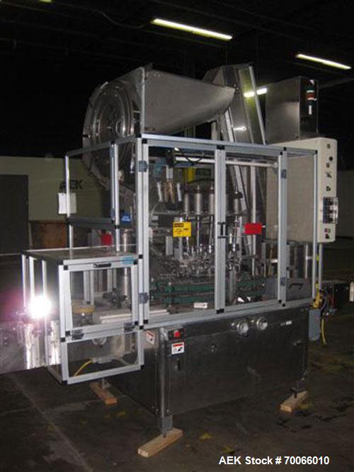 Used Resina Inline Quill Capper, 8 Quill, Model UN40-1250. Capable of speeds over 250 Bottles per minute. Has a cap size range from 13 - 70mm (with changeparts). Has a vertical pin style sorter for c...