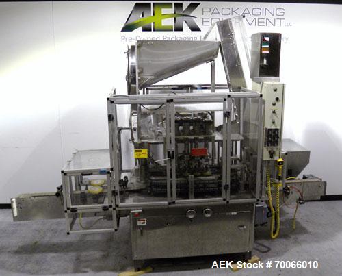 Used Resina Inline Quill Capper, 8 Quill, Model UN40-1250. Capable of speeds over 250 Bottles per minute. Has a cap size range from 13 - 70mm (with changeparts). Has a vertical pin style sorter for c...
