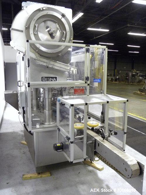 Used Resina Inline Quill Capper, 8 Quill, Model UN40-1250. Capable of speeds over 250 Bottles per minute. Has a cap size range from 13 - 70mm (with changeparts). Has a vertical pin style sorter for c...